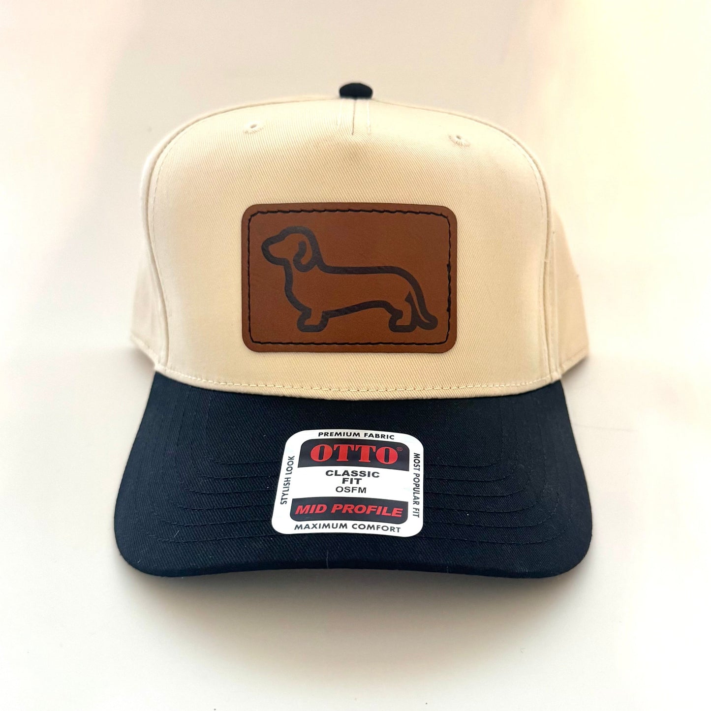 Trucker hat with dachshund logo on a leather patch