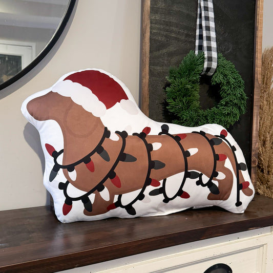 Dachshund Christmas pillow with a dachshund wrapped in Christmas lights