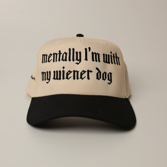 Beige woof+ween hat with black text 'mentally I'm with my wiener dog'