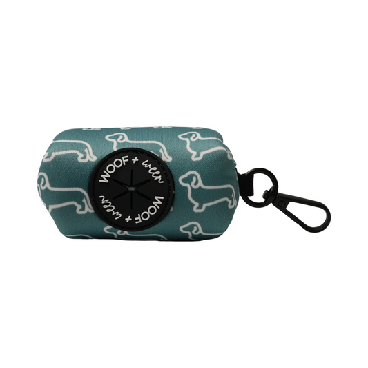 Teal waste bag pouch with white dachshund pattern and 'WOOF + WEEN' branding