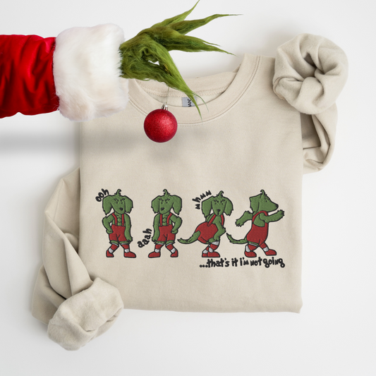 Embroidered tan crewneck sweatshirt with a dachshund grinch design