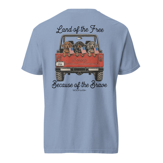 Light blue t-shirt with a graphic of a Jeep with dogs and text on the back, on a white background.
