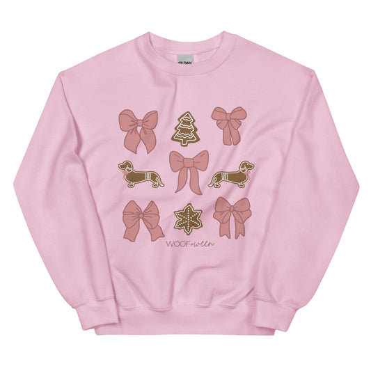 Pink crewneck sweatshirt with pink coquette bows and gingerbread dachshunds for Christmas