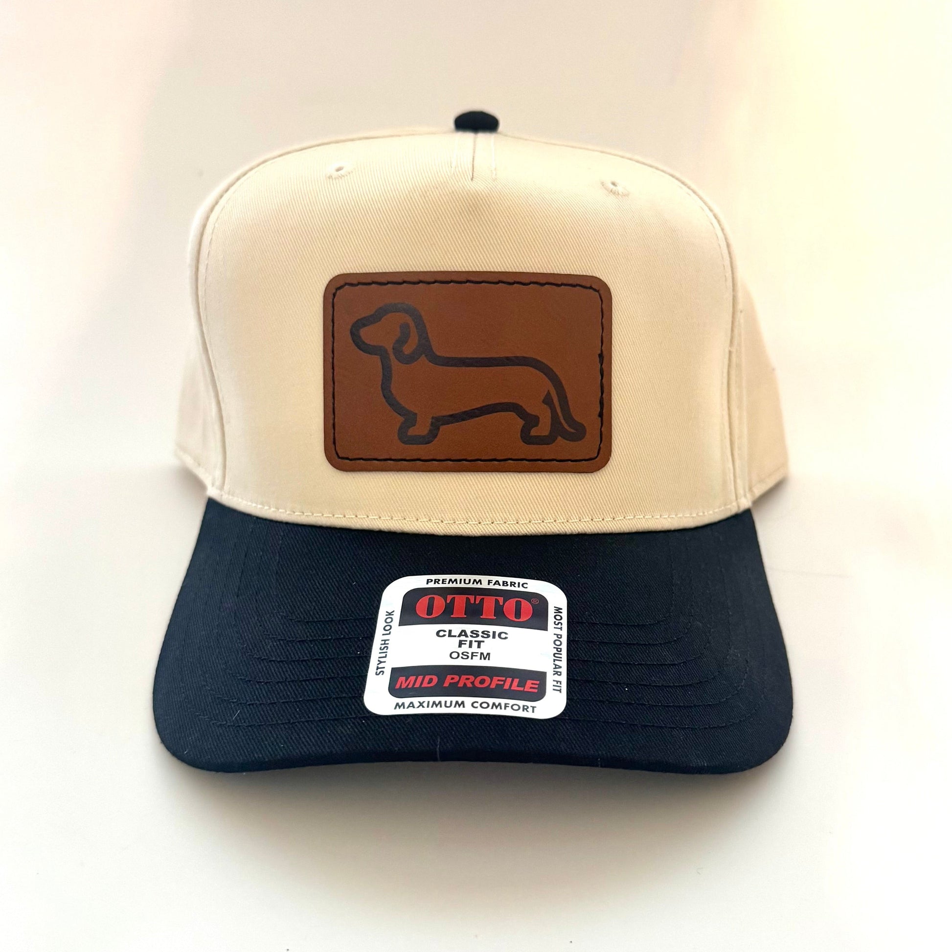 Trucker hat with dachshund logo on a leather patch