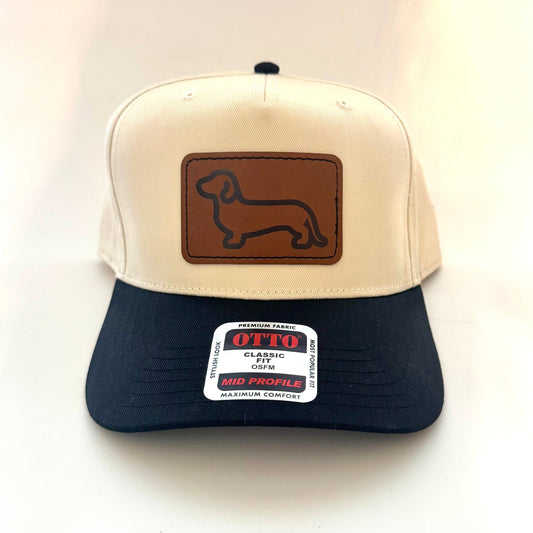 Trucker hat with dachshund logo on a leather patch