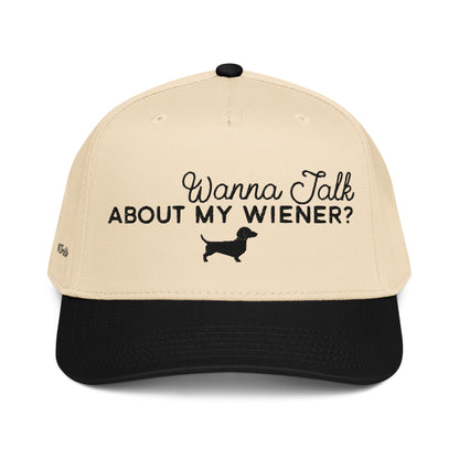 Beige and black woof+ween hat with 'Wanna Talk About My Wiener?' text and dachshund icon