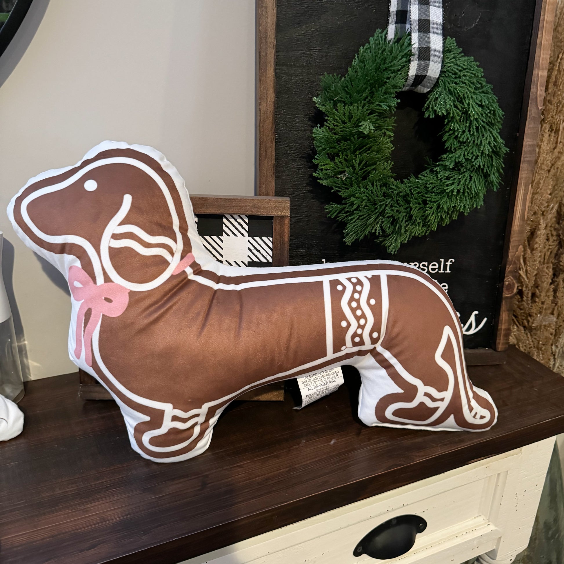 Gingerbread dachshund Christmas pillow with a pink bow