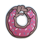 A die-cut sticker in the shape of a dachshund donut with pink frosting with white, blue, and purple sprinkles.
