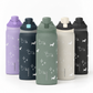 Set of five insulated bottles with dachshund pattern on a white background