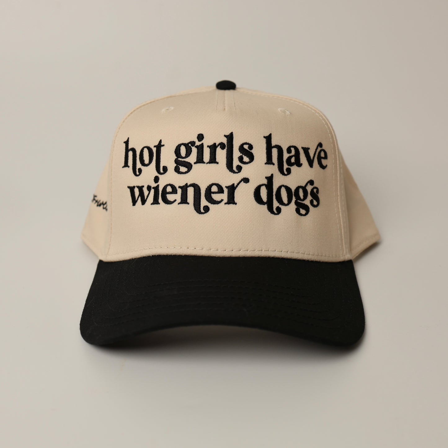 Beige and black woof+ween hat with text 'hot girls have wiener dogs' 