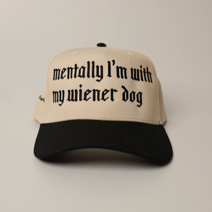 Beige woof+ween hat with black text 'mentally I'm with my wiener dog' 
