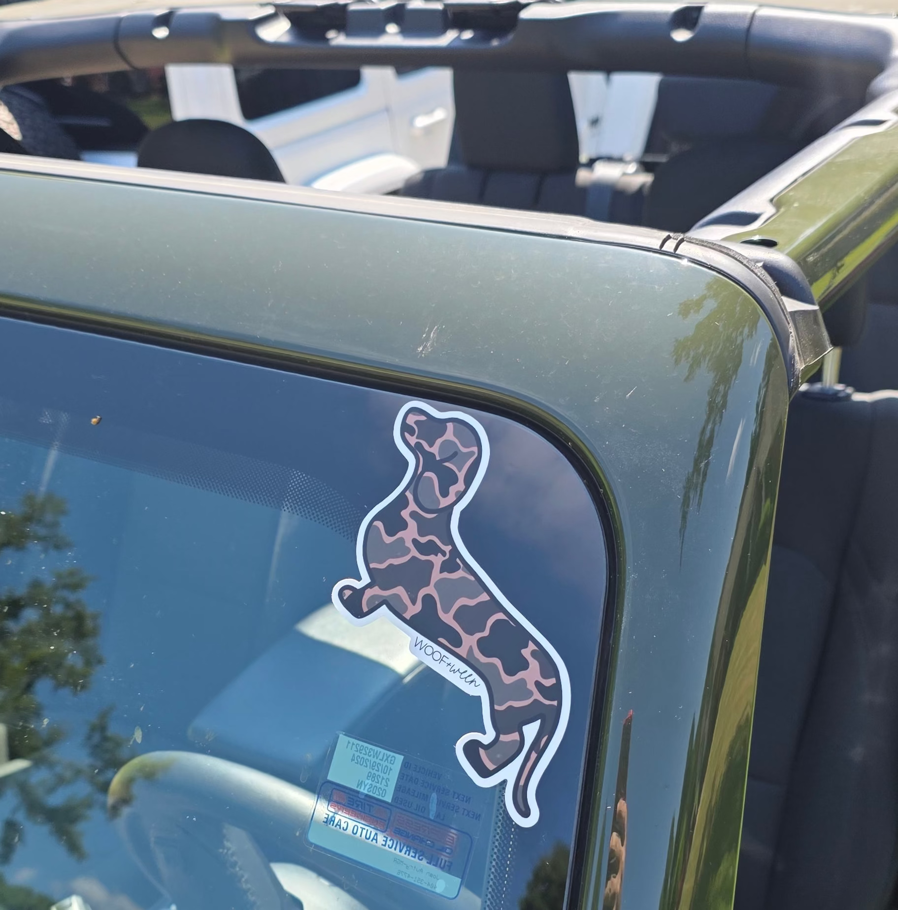 Black Duck Camo dachshund bumper sticker close-up