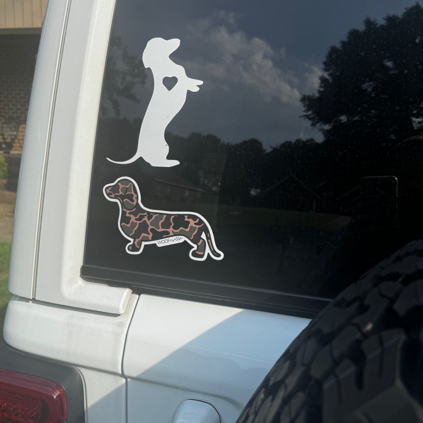 Black Duck Camo dachshund bumper sticker on laptop