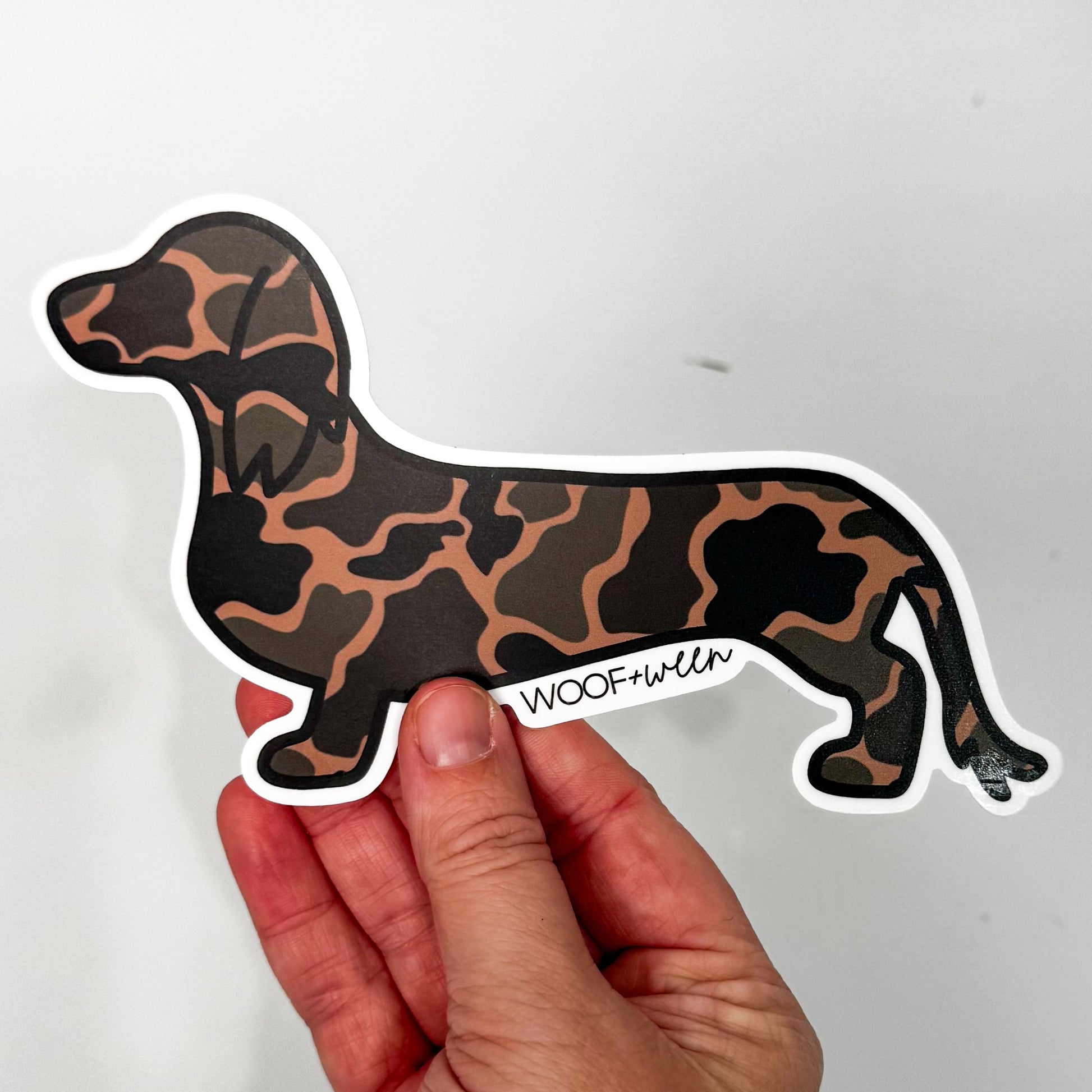 WOOF+WEEN Black Duck Camo long-haired dachshund bumper sticker