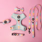 Dog harness, leash, and accessories with striped pattern