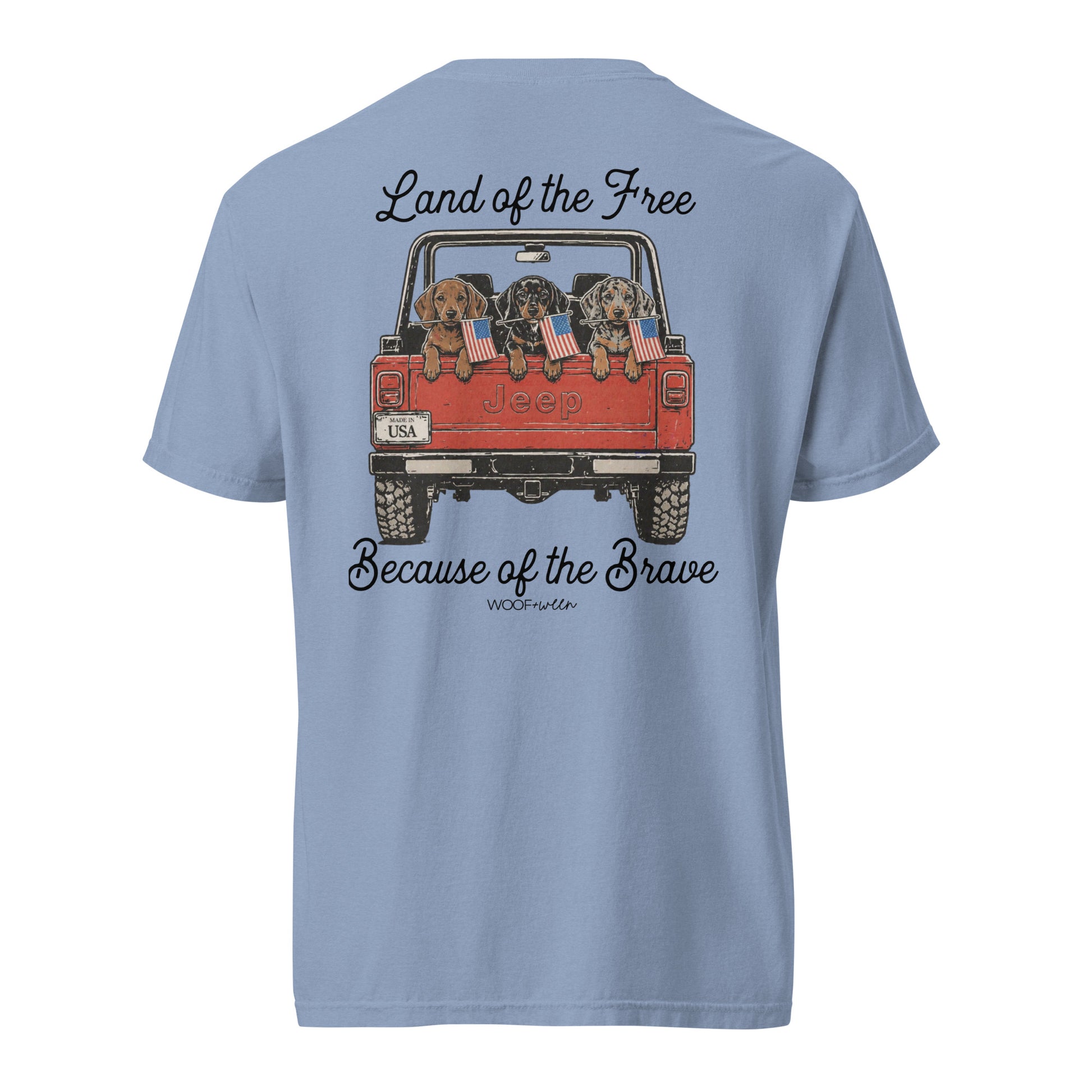 Light blue t-shirt with a graphic of a Jeep with dogs and text on the back, on a white background.