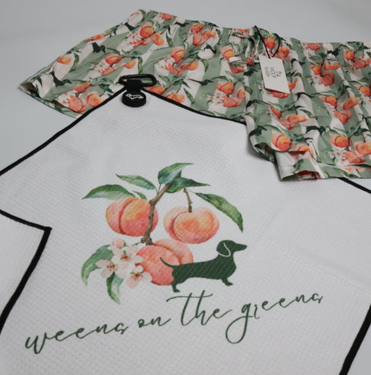 Peach Doxie golf towel clipped to golf bag