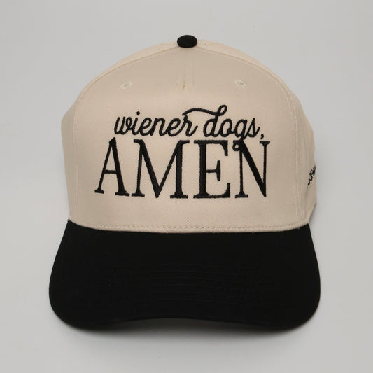 Beige and black cap with 'wiener dogs, AMEN'